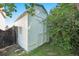 Outdoor storage shed painted white, situated in the backyard with surrounding greenery at 6248 W 75Th, Arvada, CO 80003