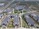 Aerial view of school buildings with solar panels and athletic fields in a planned community at 5434 N Xenia St, Denver, CO 80238