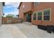 Spacious concrete patio with fence, perfect for outdoor living and entertaining, accessed by sliding glass doors at 5434 N Xenia St, Denver, CO 80238