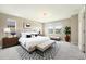 Bright bedroom with large windows, neutral tones, and stylish decor at 5434 N Xenia St, Denver, CO 80238