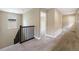 Second floor hallway features stairway and carpeted floor at 5434 N Xenia St, Denver, CO 80238