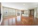 Spacious living area features hardwood floors, natural light, and open access to other rooms at 5434 N Xenia St, Denver, CO 80238
