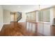 Open living space featuring hardwood floors, lots of natural light, and a staircase at 5434 N Xenia St, Denver, CO 80238