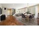 Spacious living and dining area with hardwood floors, staircase and ample natural light at 5434 N Xenia St, Denver, CO 80238
