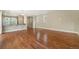 Hardwood flooring in an open space provides natural lighting in this airy living space at 5434 N Xenia St, Denver, CO 80238