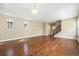 Spacious living room with hardwood floors and neutral walls, filled with natural light at 5434 N Xenia St, Denver, CO 80238