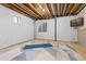 Unfinished basement with a carpeted floor, offering potential for customization and added living space at 2587 Foothills Canyon Ct, Highlands Ranch, CO 80129