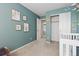 Bedroom features soft blue walls, natural light, and a closet at 2587 Foothills Canyon Ct, Highlands Ranch, CO 80129
