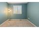 Serene bedroom with soft blue walls, natural light, and neutral carpet at 2587 Foothills Canyon Ct, Highlands Ranch, CO 80129