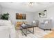Comfortable living room features neutral decor, stylish furniture and hardwood floors at 2587 Foothills Canyon Ct, Highlands Ranch, CO 80129