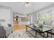 Cozy living room connects to kitchen, features hardwood floors and neutral paint at 2587 Foothills Canyon Ct, Highlands Ranch, CO 80129