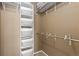 Walk-in closet with shelving and hanging racks, providing efficient and organized storage space at 2587 Foothills Canyon Ct, Highlands Ranch, CO 80129