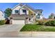 Charming two-story home with well-manicured lawn and attached two car garage at 1743 Brookside Dr, Highlands Ranch, CO 80126