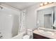 Bright bathroom with a shower-tub combination, complemented by a vanity and well-lit mirror at 16141 Bolling Dr, Denver, CO 80239
