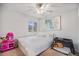 Bright bedroom with natural light, featuring a comfy bed and play area, creating a playful atmosphere at 16141 Bolling Dr, Denver, CO 80239