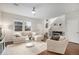 Bright living room featuring neutral tones, plush seating, and wood floors, creating a welcoming space at 16141 Bolling Dr, Denver, CO 80239