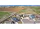 An aerial view of new homes in a subdivision near open spaces and the mountains at 853 Stagecoach Dr, Lafayette, CO 80026