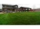 Extensive backyard with lush green grass, a gazebo, and ample room for outdoor activities at 853 Stagecoach Dr, Lafayette, CO 80026
