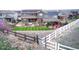 Spacious backyard with an outdoor kitchen, well manicured lawn, and inviting seating areas at 853 Stagecoach Dr, Lafayette, CO 80026