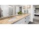 Bright bathroom with granite countertops, double sinks, and modern fixtures at 853 Stagecoach Dr, Lafayette, CO 80026
