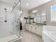 Bathroom with a glass-enclosed shower and vanity, light gray walls and modern finishes at 853 Stagecoach Dr, Lafayette, CO 80026