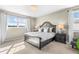 Bedroom featuring a large bed, decorative lamps, and a view of the outside landscape at 853 Stagecoach Dr, Lafayette, CO 80026