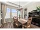 Dining area featuring a wood table, ample seating, and a buffet with beverage storage at 853 Stagecoach Dr, Lafayette, CO 80026