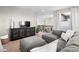 Cozy living room with comfortable gray sectional sofa and decorative furniture at 853 Stagecoach Dr, Lafayette, CO 80026
