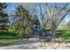 Autumn Ash Park featuring a colorful playground, walking path, and trees, offering a great place for Gathering recreation and outdoor activities at 803 W Lucerne Dr, Lafayette, CO 80026