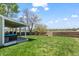 Spacious backyard featuring a well-maintained lawn, wooden fence and covered patio perfect for outdoor living at 803 W Lucerne Dr, Lafayette, CO 80026