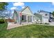 Charming single-story home with a well-manicured lawn, tidy landscaping, and inviting front porch at 803 W Lucerne Dr, Lafayette, CO 80026