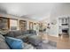 Open living room featuring recessed lighting, hardwood floors, and views into the kitchen and dining area at 803 W Lucerne Dr, Lafayette, CO 80026