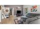 Open living room with hardwood floors, large windows, a sliding glass door and gray paint at 803 W Lucerne Dr, Lafayette, CO 80026