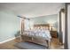 Comfortable main bedroom featuring a king size bed, sliding glass door, and hardwood floors at 803 W Lucerne Dr, Lafayette, CO 80026