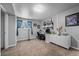 Functional home office featuring a spacious desk, modern shelving, and ample natural light, perfect for productivity at 803 W Lucerne Dr, Lafayette, CO 80026