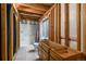 Unfinished bathroom showing new shower, toilet, tiled floor, plumbing, and framing, ready for customization at 5033 Goshawk Ct, Brighton, CO 80601