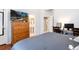 Bedroom featuring a large dresser and a desk, providing ample storage and workspace at 5033 Goshawk Ct, Brighton, CO 80601