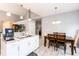 Bright kitchen showcasing white cabinets, granite countertops, stainless steel sink, and modern appliances at 5033 Goshawk Ct, Brighton, CO 80601