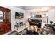 Open living room connected to kitchen featuring vaulted ceilings and an open floorplan concept at 5033 Goshawk Ct, Brighton, CO 80601