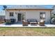 Relaxing patio with comfortable seating and a dining table perfect for outdoor entertainment at 5033 Goshawk Ct, Brighton, CO 80601