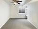 Spacious finished basement bedroom with ceiling fan and built-in shelving at 1090 Quail Cir, Brighton, CO 80601