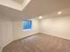 Finished basement with neutral carpet and large window at 1090 Quail Cir, Brighton, CO 80601