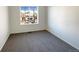 Bright bedroom with grey carpet and a large window at 1090 Quail Cir, Brighton, CO 80601
