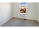 Bright bedroom with carpet flooring and a view from the window at 1090 Quail Cir, Brighton, CO 80601