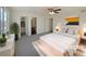 Virtually staged main bedroom with ensuite bathroom and walk-in closet at 1090 Quail Cir, Brighton, CO 80601