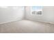 Cozy bedroom features plush carpet and a bright window with great light at 17424 E 90Th Pl, Commerce City, CO 80022