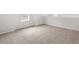 Neutral carpeted bedroom with three power outlets, bright natural light, and neutral walls at 17424 E 90Th Pl, Commerce City, CO 80022