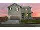 Charming two-story home with a well-manicured lawn and an attached two-car garage at 17424 E 90Th Pl, Commerce City, CO 80022