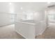 Bright loft area featuring neutral walls, carpeting, and ample natural light at 17424 E 90Th Pl, Commerce City, CO 80022