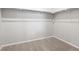 Walk-in closet features carpet and built in shelving for ample storage at 17424 E 90Th Pl, Commerce City, CO 80022